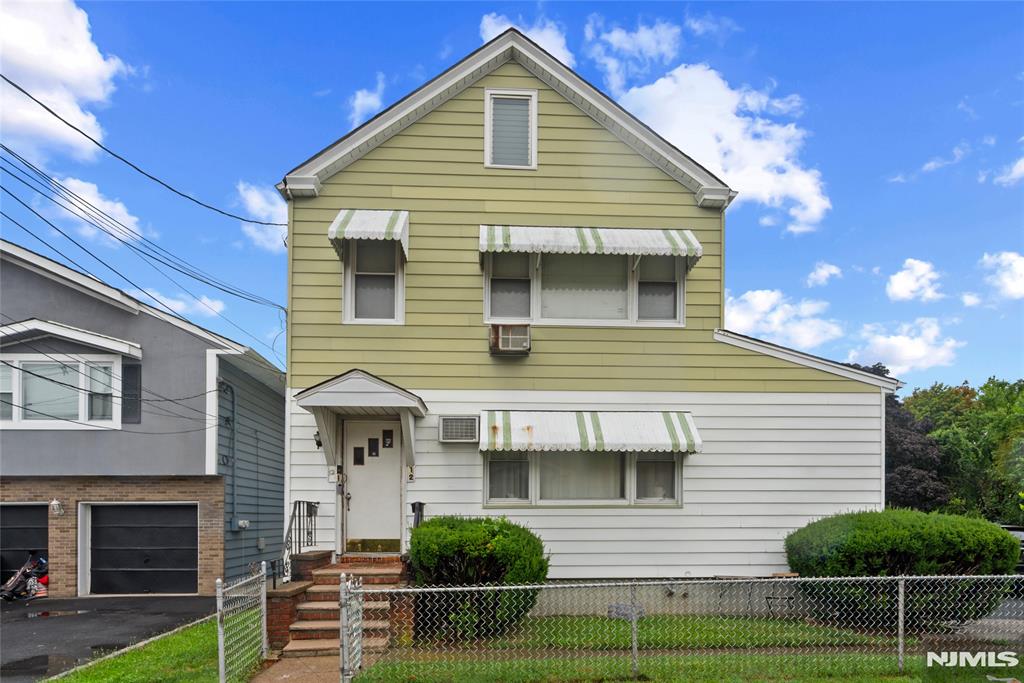 Welcome to 12 Boyd St, a fantastic opportunity for investors and owner-occupants alike! Ideally situated on a quiet dead-end street, this income-producing two-family home offers 5 bedrooms and 2 full bathrooms, providing versatile living arrangements and excellent rental potential. The home features a walkout basement leading to a large backyard, perfect for outdoor enjoyment, along with an attached garage and a two-car-width driveway for ample off-street parking. Conveniently located near shopping, dining, schools, and major transportation routes, this property combines comfort, functionality, and investment value in one desirable package. Don't miss your chance to own this exceptional multi-family property with endless possibilities. This property is being sold as is.
