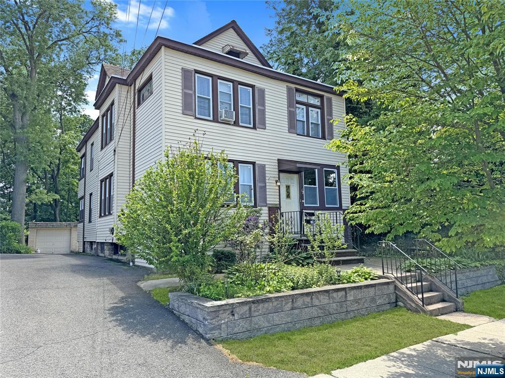 Exceptionally maintained 2-family home situated in residential neighborhood, just moments from parks, public transportation, major highways, and shopping. Both units have been tastefully updated and are in immaculate condition, each with separate gas and electric utilities. The property features an unfinished walk-up attic, a two-car garage, and generous off-street parking. Laundry area conveniently located in the basement. Whether you're looking to move in or invest, this move-in-ready home offers outstanding value in a prime location.