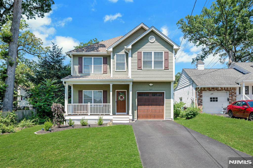 Stunning custom-built Colonial offering 4 spacious bedrooms and elegant living throughout. Enjoy an open floor plan with 9-ft ceilings, crown molding, and gleaming hardwood floors. Kitchen features granite countertops, a breakfast bar, high-end stainless steel appliances, and sliders leading to a private deck perfect for entertaining. Relax in the inviting family room with a cozy gas fireplace. The elegant primary suite boasts a cove ceiling,custom walk-in closet, and a luxurious en suite bath with a soaking tub. The fully finished basement includes a gym, media room, play space, and office area with dry bar. Additional highlights include a finished walk-up attic, one-car garage, charming front porch, and a large, flat fenced-in backyard.. Convenient and efficient Mini split WiFi controlled ac/heat unit in basement. ADT alarm system. Hybrid twin tank water system throughout entire house. Level 2 (240v) car charging station. Located just a short distance to the train station with direct access to NYC this home blends comfort, style, and convenience in one perfect package! Agent Remarks: Stunning custom-built Colonial offering 4 spacious bedrooms and elegant living throughout. Open floor plan with 9-ft ceilings, crown molding, and gleaming hardwood floors. Kitchen features granite countertops, a breakfast bar, high-end stainless steel appliances, & sliders leading to a private deck