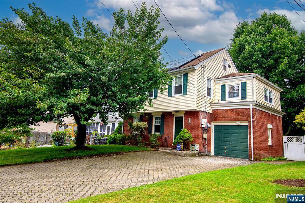 Welcome to this charming east facing, expanded colonial. Filled with natural light, this inviting home features oak hardwood floors, central air, a finished basement with a rec room. Step outside to a private, fenced yard with a deck. Conveniently located near schools, shopping, Memorial Park and NYC transportation. This home is ready for you to move in!