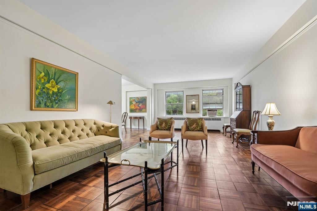 Welcome to The Rockcliffe, one of Montclair's most sought-after full-service co-op communities. This spacious 2-bedroom, 2-bath residence offers a rare opportunity to create the home you've always envisioned.Filled with generous living spaces, the unit features a well-designed layout with two comfortable bedrooms, including a primary suite with its own full bath. The kitchen is currently mid-renovation and will be conveyed in its present condition, providing the next owner with a unique chance to complete the space according to their personal style and preferences.This is your opportunity to customize one of the home's most important spaces without paying for someone else's choices. Washer and dryer hookup in unit. Also shared laundry in basement. All appliances "as is". The monthly maintenance is $2,032.62. Monthly maintenance fee includes heat, hot water, gas, sewer, trash, concierge, live-in super, maintenance of common areas, underlying mortgage and property taxes. Garage is $60 a month, outside parking is $35 a month. Number of shares is 586. Up to two cats are allowed.