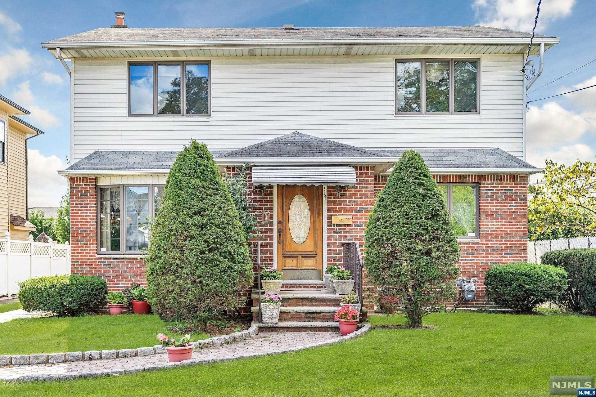 Welcome to this spacious, custom designed & expanded (entire 2nd floor added) 4 bedroom, 2.5 bath colonial home. A warm and inviting living room, extra large, sun filled kitchen, formal dining room, powder room and bedroom (or home office) complete the first floor. Venture upstairs to find a king size master bedroom with walk in closet, 2 more queen size bedrooms & a full tile bath. Pull down stairs give access to plenty of attic storage. The basement is fully finished and heated with a comfortable family room, storage room, laundry and utility center and newer full bath. Hardwood and tile flooring, Central A/C,3 zone gas baseboard heat & generous closet space add to the many highlights of this lovely home. An extra long driveway wraps around the rear of this large property to a garage lover's delight! An oversized custom built, 2 car garage w/extra storage situated on a quiet picturesque street and yet perfectly located for the commuter.Just a short walk to NY & NJ transportation