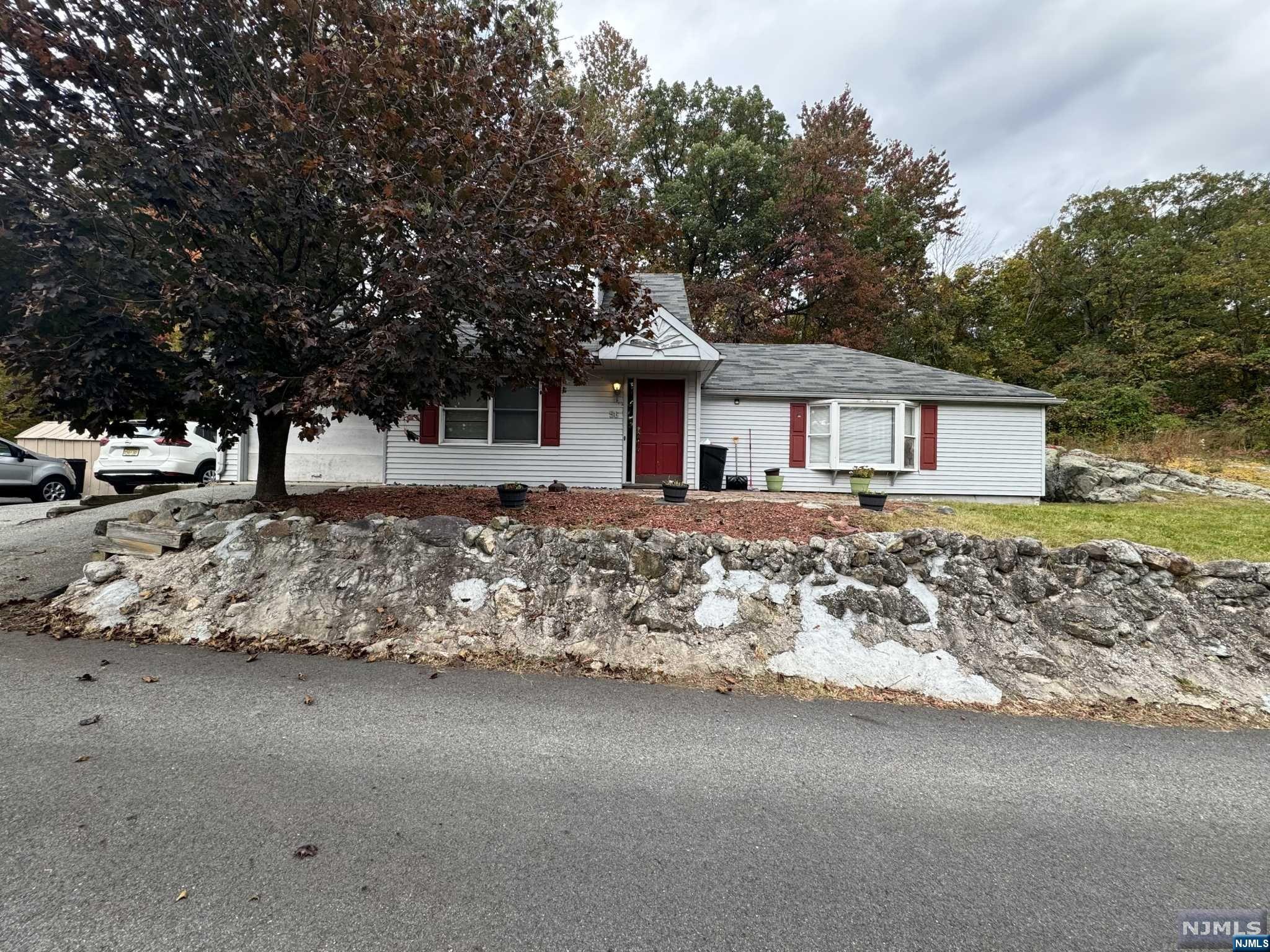 Welcome to 56 Greenwood Lake Turnpike. Surrounded by natural beauty a short drive away, this 3 bedroom 1.5 bath expanded ranch sits in a cozy part of Ringwood. Enjoy this home featuring cathedral ceilings, 2 bedrooms on the main floor with living room, kitchen, full bath and laundry, Second floor another bedroom with half bath. Great Value , offered as is, come see how this property could be yours!
