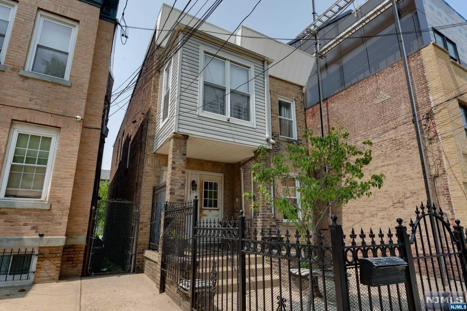 Jersey CITY HEIGHTS! Here's the one you've been waiting for! This LEGAL 2 UNIT Home w/ separate entrances has 5 total bedrooms (additional rooms too) 3 FULL Bathrooms & a huge Basement with its own entrance! Near ALL Means of public transportation to NYC: PATH, NJTransit, Driveway, a Beautiful Backyard for sunny days and gatherings. This is a great opportunity to make this, solid investment: YOURS!