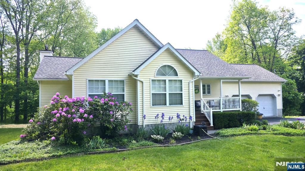 Charming and beautifully maintained, this inviting ranch is set well back from the road on over 2.5 private acres, offering both serenity and space. A welcoming rocking chair porch sets the tone for relaxed living. Inside, you'll find three comfortable bedrooms, including one highlighted by a stunning architectural window that fills the space with natural light. The spacious primary suite features a walk-in closet and an exceptionally large bathroom designed for comfort and ease. The thoughtfully finished full walkout basement adds valuable living space and provides direct access to the backyard, perfect for recreation, entertaining, or multi-purpose use. Major updates have already been completed, including a new roof, new central air and updated mechanical systems, giving you confidence and peace of mind. An oversized two-car garage offers ample storage and workspace. Outside there's a huge 10' x 20' prefab shed to house all your gardening needs or act as an outdoor workshop. Surrounded by mature trees, expansive property and no neighbors on one side, the setting feels wonderfully private while remaining conveniently located near major highways, shopping, and everyday amenities. Jefferson Twp. is home to hiking trails, lakes and some of the best ski slopes in the area, so there's lots of outdoor recreation to enjoy! This home combines charm, practicality, and privacy in one exceptional offering so be sure to schedule your viewing quickly before it's gone!