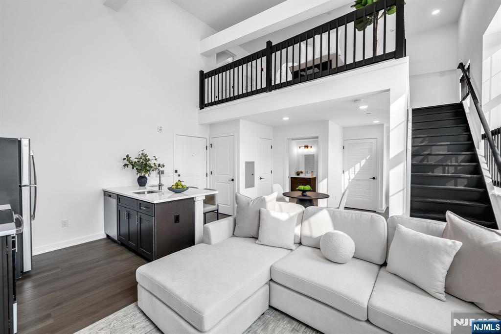 * NEW YEAR SPECIAL - ONE MONTH FREE ON A 13 MONTH LEASE OR 2 MONTHS FREE ON A 15 MONTH LEASE IF SIGNED BEFORE 1/15 & $1000 SECURITY DEPOSIT * Discover pure luxury in this stunning, new construction 1 Bedroom Loft / 2 Bathroom apartment conveniently located in highly sought after East Rutherford. Stretching across 963 SqFt, this brand new unit features lofted ceilings, gleaming wood floors, in unit washer/dryer, multi-zone heating and cooling, and plenty of sunlight throughout the day. First floor includes entry foyer, kitchen, living room, dining room, full bathroom, and laundry. Chef's kitchen features SS appliances, custom cabinets, quartz countertops, and breakfast bar. Completing this beautiful home is a second floor with bedroom, ensuite bathroom, and walk-in closet. 315 Railroad is a one-of-a-kind building featuring virtual doorman, resident patio, dog run, and ample parking. Conveniently located just steps from downtown East Rutherford & Rutherford, NJ Transit train station and bus stop, restaurants, shopping, parks, and schools. This rare opportunity is one you don't want to miss! * NEW YEAR SPECIAL - ONE MONTH FREE ON A 13 MONTH LEASE OR 2 MONTHS FREE ON A 15 MONTH LEASE IF SIGNED BEFORE 1/15 & $1000 SECURITY DEPOSIT *