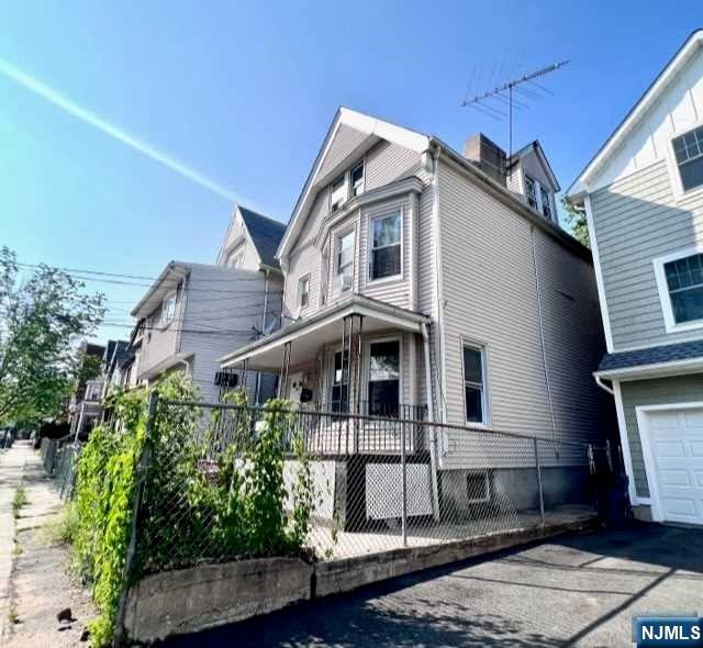 Large two family house with bonus unit on the 3rd floor. Perfect opportunity for Investor. TLC needed.