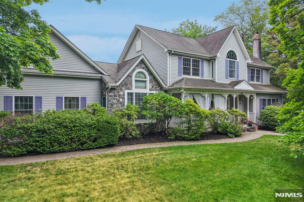 Sunlit Colonial, gracefully set on a lush, landscaped property in the sought-after Somerville district. Victorian-inspired architecture, a romantic lemonade porch, & a grand entry create striking architectural presence in this 1990s-built home. Sunny living room/ fireplace, banquet-sized dining room, office, & gourmet kitchen with granite countertops, walk-in pantry, custom pressed-tin range hood, & sunny breakfast area. The dramatic family room showcases a starburst cathedral ceiling & seamless access to the backyard & attached two-car garage, creating exceptional flow. Upstairs, the expansive primary ensuite offers a luxurious private retreat, complemented by three additional bedrooms & full hall bath, and the expansive finished basement extends further rec spaces. Mature landscaping frames the property, creating privacy & tranquil outdoor spaces for relaxation & gathering. Enjoy rare convenience to all three schools, the Duck Pond, downtown shops, restaurants, & transportation