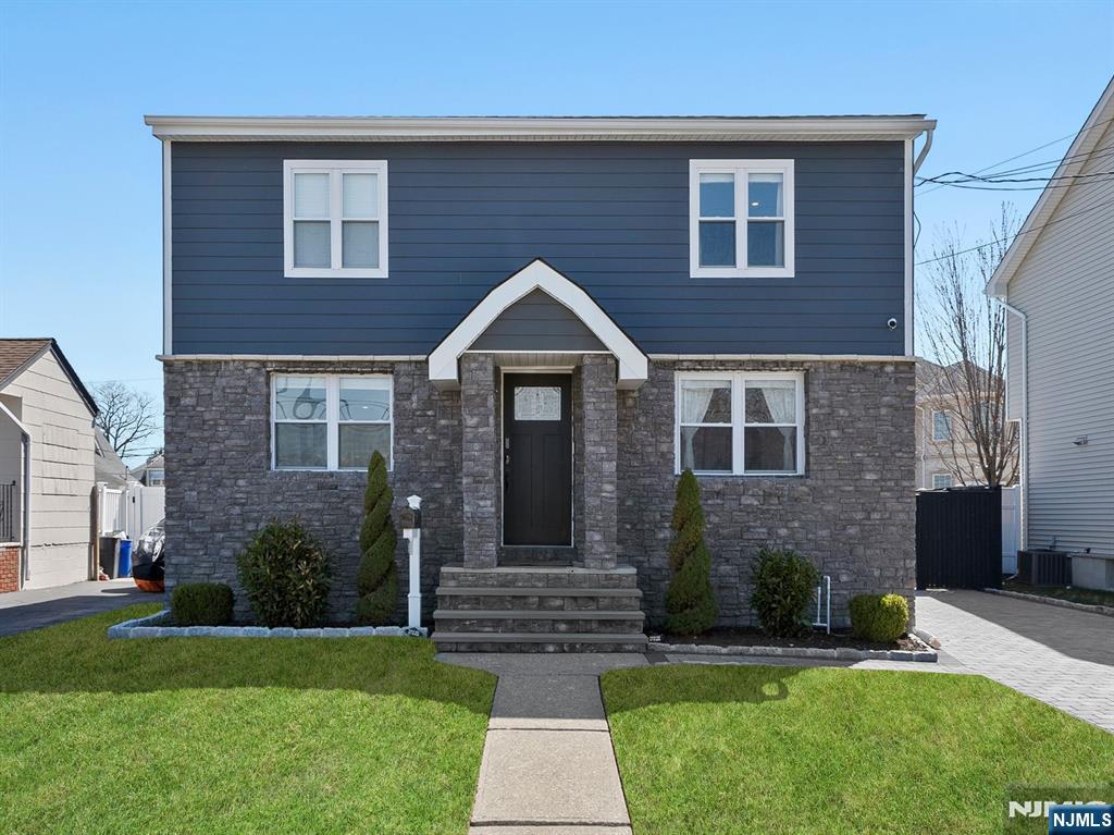This beautifully completely renovated home has it all! The stunning eat-in kitchen offers a spacious breakfast bar island, ample counter space, and sleek stainless steel appliances. The inviting living room, complete with an electric fireplace, flows seamlessly through French doors onto a charming paver patioâ€”ideal for indoor-outdoor entertaining. The first floor includes two bedrooms, a full bath, and a convenient laundry area. Upstairs, the primary suite offers a massive walk-in closet and access to a full bath, plus two additional bedrooms and a must-see rooftop entertainment area. A fully finished basement with a walk-out exit and a full bath provides endless possibilities for extra living space. Situated in a sought-after Saddle Brook neighborhood with easy access to NYC transportation, shopping, and dining, this exceptional home is a must-see!