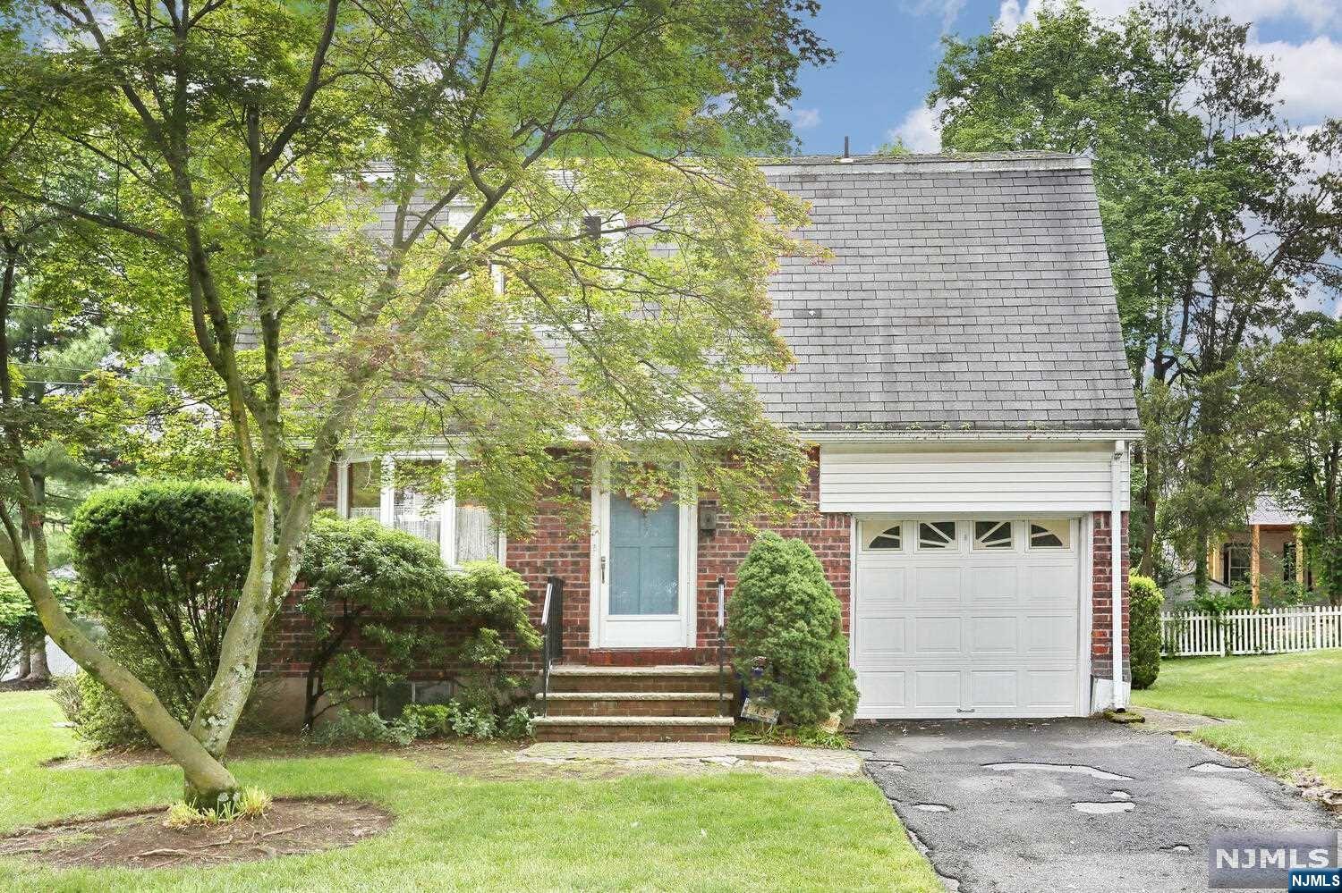 GREAT OPPORTUNITY TO GET INTO THE GREAT TOWN OF CRESSKILL IN A LOCATION THAT IS IDEAL. WALKING DISTANCE TO EVERYTHING FROM GRAMMAR SCHOOL,TO HIGH SCHOOL,ALL MUNICIPAL FIELDS,SHOPPING AND ALL THAT THIS BLUE RIBBON TOWN HAS TO OFFER. THIS FINE HOME FEATURES AN ENTRY THAT LEADS ITO THE LARGE LIVING ROOM, THE DINING ROOM,AND FAMILY ROOM WITH VAULTED CIELINGS,A DOOR GOES OUT TO LARGE DECK WHICH OVERLOOKS LARGE PROFESSIONALLY LANDSCAPED PROPERTY.THE KITCHEN IS A NICE SIZE AND LEADS TO MAIN FLOOR LAUNDRY AS WELL AS A HALF BATHROOM. THERE IS BEAUTIFUL HARD WOOD FLOORING UNDER ALL CARPET THAT IS JUST WAITING TO BE BROUGHT BACK TO ITS ORIGINAL LUSTER.NOW ON TO THE SECOND FLOOR WHERE YOU WILL FIND THREE VERY NICE SIZE BEDROOMS ALL WITH HARDWOOD FLOORING,UPDATED WINDOWS, AMPLE CLOSET SPACE. AND A FULL BATH. THE BASEMENT IS WHERE YOU WILL FIND,5 YEAR OLD FURNACE, CENTRAL AIR AND NEWER HWH. THERE IS PLENTY OF STORAGE,UPDATED 200 AMP ELECTRIC,OTHER AMMENITIES INCLUDE ONE CAR GARAGE,AND LOW TAXES