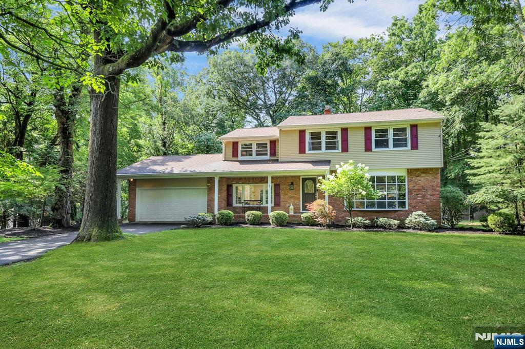 Beautifully updated Colonial offering charm & modern updates on nearly one acre of private, tranquil property in coveted West Montvale. Designed with an exceptional flow, the main level features spacious living & dining room that open to a beautiful deck & bluestone patio, ideal for effortless indoor/outdoor entertaining. Upstairs offers a generous primary suite with a walk-in closet & renovated en-suite bath with an oversized shower, plus three additional bedrooms & a full bath. The unfinished basement with high ceilings offers outstanding future expansion potential & includes the laundry area. Fenced yard surrounded by mature shade trees for exceptional privacy. A 2-car garage includes an EV charger. Just minutes to downtown shopping, parks, and transportation. Move-in-ready homes at this price point rarely become available in this highly desirable neighborhood. Don't miss this exceptional opportunity! HURRY!