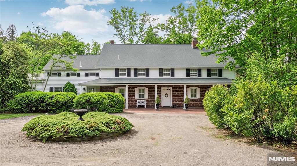 RARE OPPORTUNITY to own a definitive piece of American history with the Van Buskirk Home, the very first residence built in Saddle River. Circa 1707, this Red Sandstone Dutch Colonial has a storied past while sitting on over 2 lush acres offering modern amenities such as a freeform pool, oversized patios, and a tennis court - all perfect for entertaining. The residence underwent extensive updates/renovations in the mid 1990s, including a full kitchen addition, bathroom updates, new plumbing and electric, structural reinforcement with new beams, refinished flooring, new roof, and more. Enter to find masterfully preserved heritage with grand hand-hewn beams, wide-plank floors, and 4 original fireplaces, including an architecturally distinct open loft/great room with 13-foot beamed cathedral ceilings. Modern aesthetics integrate through thoughtful updates, featuring a chefâ€™s kitchen with radiant heated floors and living space where walls of glass offer serene views of the pond and waterfall. Completing the primary levels is a stately home office, first-floor primary suite with a steam shower, plus four upstairs bedrooms and two baths. A hidden door off the entry foyer leads to a basement with significant improvements, posing exceptional potential for finished space. Enjoy the versatile heated barn provides two car bays, horse stalls, and a massive second floor perfect for a gym, studio, or party space. This is a once-in-a-generation opportunity to steward a landmark property!