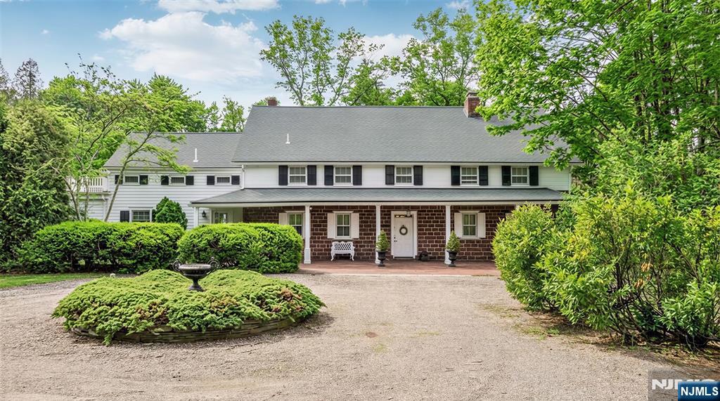 RARE OPPORTUNITY to own a definitive piece of American history with the Van Buskirk Home, the very first residence built in Saddle River. Circa 1707, this Red Sandstone Dutch Colonial has a storied past while sitting on over 2 lush acres offering modern amenities such as a freeform pool, oversized patios, and a tennis court - all perfect for entertaining. The residence underwent an extensive updates/renovations im the mid 1990s, including a full kitchen addition, bathroom updates, new plumbing and electric, structural reinforcement with new beams, refinished flooring, new roof, and more. Enter to find masterfully preserved heritage with grand hand-hewn beams, wide-plank floors, and 4 original fireplaces, including an architecturally distinct open loft/great room with 13-foot beamed cathedral ceilings. Modern aesthetics integrate through thoughtful updates, featuring a chefâ€™s kitchen with radiant heated floors and living space where walls of glass offer serene views of the pond and waterfall. Completing the primary levels is a stately home office, first-floor primary suite with a steam shower, plus four upstairs bedrooms and two baths. A hidden door off the entry foyer leads to a basement with significant improvements, posing exceptional potential for finished space. Enjoy the versatile heated barn provides two car bays, horse stalls, and a massive second floor perfect for a gym, studio, or party space. This is a once-in-a-generation opportunity to steward a landmark propert
