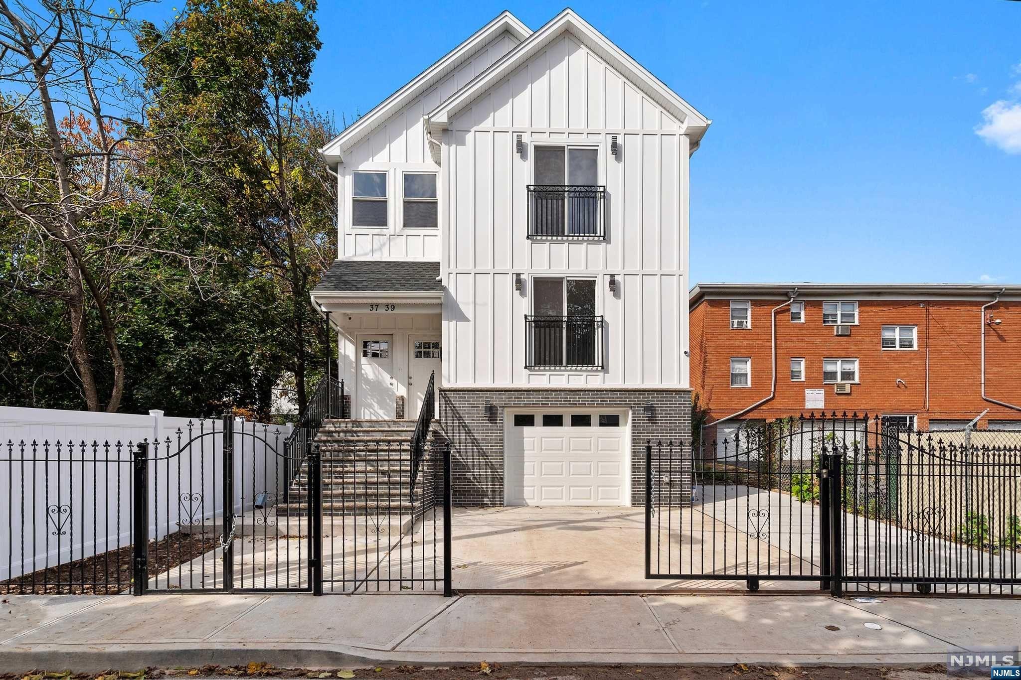 Prepare to be wowed by this exquisite two-unit new construction in the heart of Irvington. MOVE RIGHT IN to this one-of-a kind property with high-end luxury finishes throughout. Unit 1 welcomes you into a sun-drenched open concept living/dining room with hardwood floors and neutral palettes. Fall in love with the kitchen featuring SS appliances, abundant quartz countertops and backsplash, pot filler over the gas range, and a center island equipped with pendant lighting and space for a drawer microwave. This unit features a master bedroom, 2 additional bedrooms, a main luxurious bath, and provides access to the basement level offering a family room, office room, storage rooms, an additional full bath and access to the garage and backyard. Unit 2 features 3 bedrooms , 2 baths and high-end finishes as well. Must see! Property comes with a 10-year builder warranty and 5-year tax abatement.