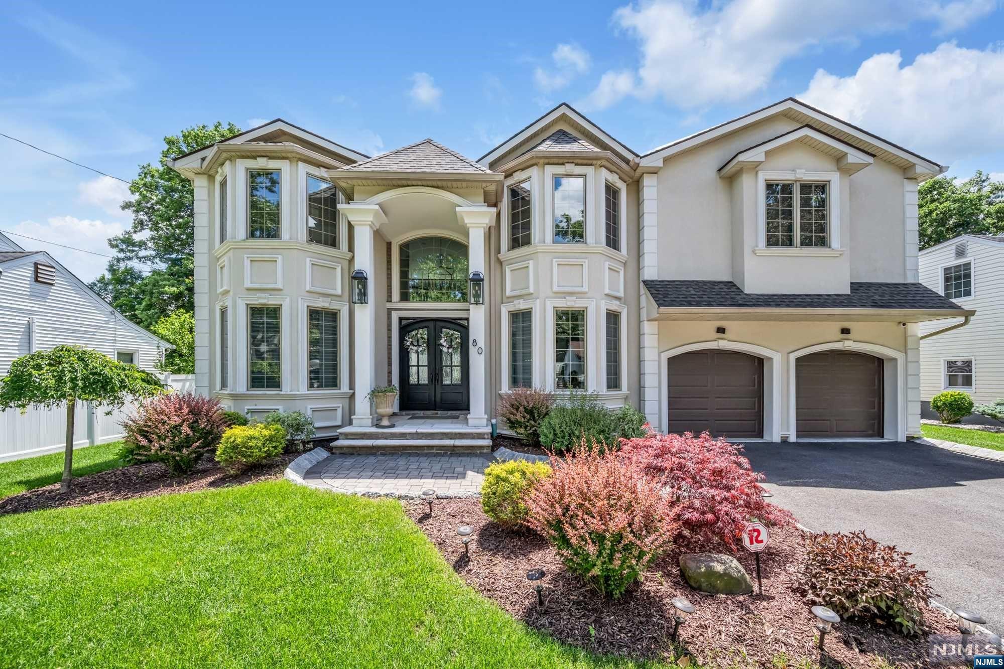 Spectacular newer build in prime Paramus location! Stunning inside & out with beautiful curb appeal. Classic center-hall colonial layout featuring 4 bedrooms, 3.5 bathrooms, and a fully finished basement. Double height entrance foyer greets you immediately. Dining room & home office on either side of the foyer. Continue along to double height family room which is open-concept to the gourmet kitchen with luxury SS appliances and huge center island. Mudroom, half-bathroom, and access to 2 car garage complete the main level. Upstairs, find 4 spacious bedrooms & laundry room. Luxurious Primary Suite with custom double walk-in-closets and spa-like bath with soaking tub, glass shower, and double vanity. Fully finished basement offers huge rec room, bonus room, and bathroom. Beautiful backyard that is fully fenced-in with paver patio. Paramus is home to low taxes, excellent school system, and plenty of amazing shopping.