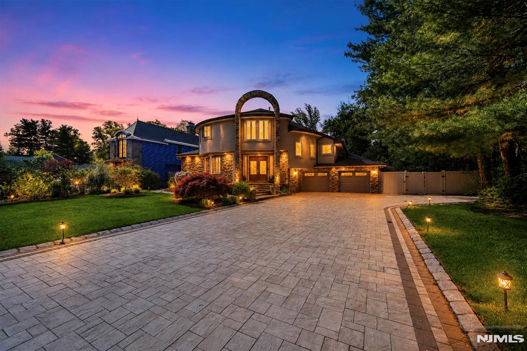 Tucked away on a private lot in one of Paramusâ€™s most sought-after neighborhoods, this beautifully renovated contemporary offers approximately 6,731 square feet of exceptional living space with 6 bedrooms and 5½ bathrooms. A striking brick and stone facade, long private driveway, and attached 2-car garage create an impressive arrival. Designed for both grand entertaining and comfortable everyday living, the light-filled interior features an elegant entry foyer, living room, formal dining room, powder room, spacious eat-in chefâ€™s kitchen, family room with fireplace, library, den/home office, and a first-floor bedroom suite with a full bath. The second level is highlighted by a luxurious primary suite with a spa-inspired bath, three additional bedroom suites with full baths, and an additional bedroom, offering remarkable flexibility for family and guests. A fully finished basement provides abundant recreation and bonus living space. Outside, a private backyard oasis awaits with a heated in-ground pool, expansive entertaining areas, and beautifully landscaped grounds that create a true resort-like setting. Combining generous living space and an exceptional Paramus location, this outstanding residence offers luxury living at its finest. The virtual tour link includes a full video tour, interactive 3D model, detailed floor plans, room dimensions & photos. https://newjerseyproper.com/mls-290-dunkerhook-rd-paramus-nj/