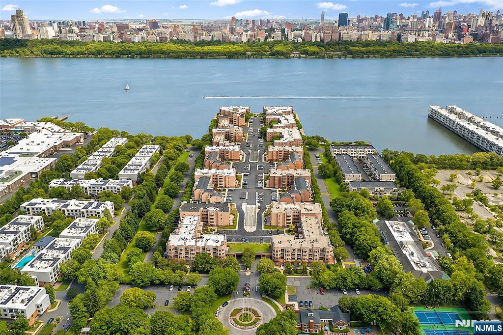 LUXURY FULLY FURNISHED RENTAL â€“ ALL UTILITIES INCLUDED! Experience effortless waterfront living in this beautifully appointed 1-bedroom condominium in the prestigious Independence Harbor community. Thoughtfully furnished with elegant, high-quality furniture and tasteful decoration, this move-in-ready home is perfect for anyone seeking comfort, convenience, and style. This bright, east-facing residence features a spacious living room, a generously sized bedroom, GE appliances, an in-unit washer and dryer, and a rare two-deeded garage parking spaces. Step outside through either the living room or bedroom to your own oversized private fenced patio, an ideal outdoor retreat for morning coffee, relaxing evenings, or entertaining guests. All utilities are included, making this an exceptional value