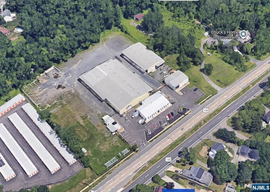Positioned along one of Central New Jersey's most heavily trafficked commercial corridors, this 6.82-acre flex / industrial / retail property presents a rare opportunity for both tenants and investors to secure a highly functional, flexible and strategically located asset. With over 42,000 square feet of existing improvements across four buildings, the property is ideally suited for a wide range of users seeking visibility, accessibility and operational efficiency. Tenants will benefit from immediate highway exposure along Route 130, strong daily traffic counts exceeding 30,000 vehicles, multiple access points for seamless ingress and egress and a layout that supports a variety of uses including contractor operations, distribution, light manufacturing, retail showroom or self-storage. The combination of clear-span industrial space, drive-in loading, ample parking and outdoor yard area creates an ideal environment for businesses that require both functionality and visibility in a growing and accessible market. NOTE: 2 parcels included in sale: 22 Route 130 (4.85 acres) and 18 Route 130 (1.97 acres). Also available for Lease at $14/SF.