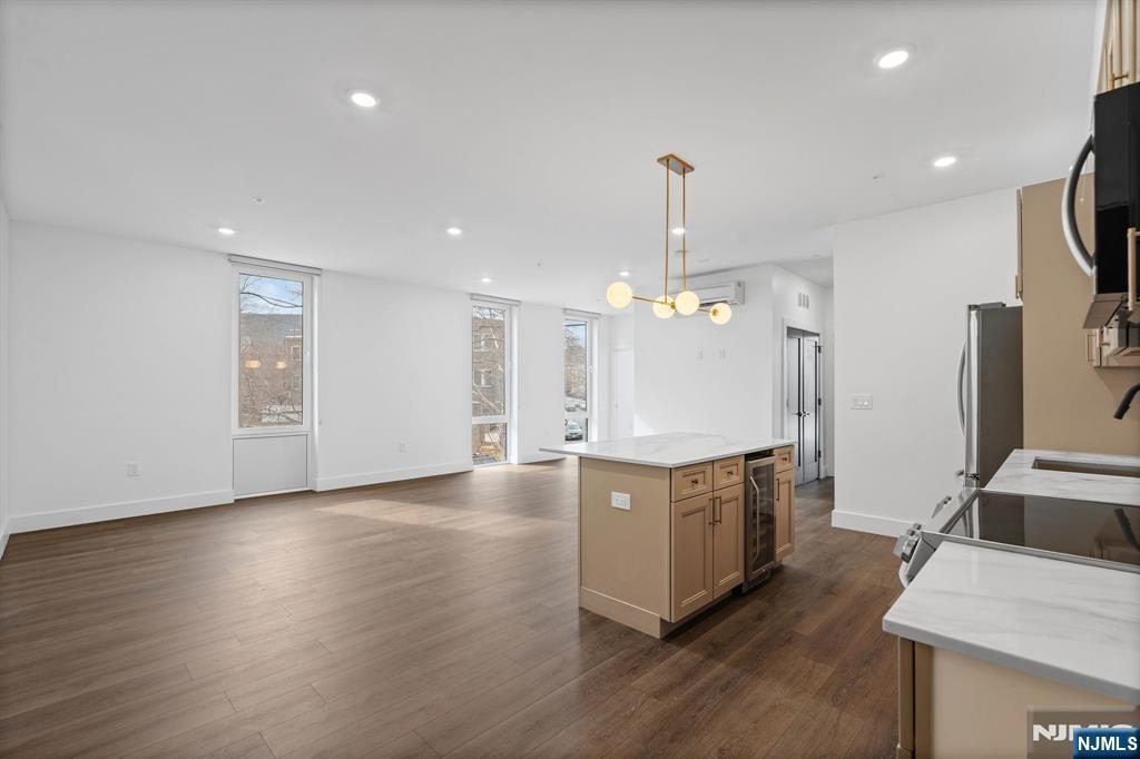 Discover this stunning 2-bedroom, 1-bathroom condo nestled in one of Newark's newest boutique condominium developments, perfectly positioned along the iconic Lincoln Park. Offered at $495,000, this move-in ready residence blends contemporary finishes with everyday comfort in one of New Jersey's most connected urban neighborhoods. Step inside to find an open, light-filled layout designed for modern living. The unit features central air conditioning and in-unit laundry for effortless convenience, while sleek finishes throughout make this home as stylish as it is functional. Commuters will love the unbeatable location just minutes from Newark Penn Station with direct PATH train access to Manhattan, and only a short drive to Newark Liberty International Airport. Whether you're heading into the city for work or catching a flight, you're always right where you need to be. Beyond your front door, Lincoln Park offers a beautiful green escape in the heart of downtown, with dining, shopping, and entertainment just steps away. This is a rare opportunity to own in one of Newark's most exciting new developments. Don't miss your chance to call 21 Lincoln Park home.