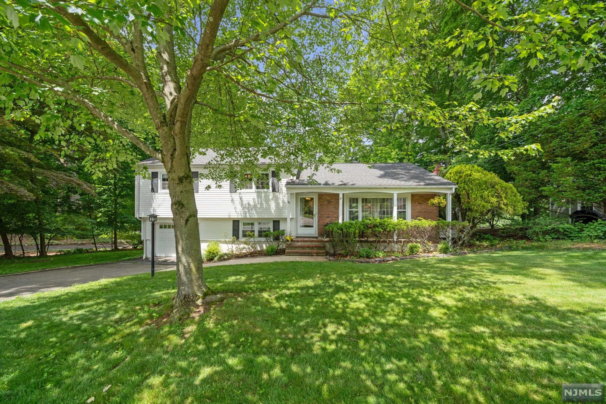 Looking for a home close to the heart of Caldwell? Close to the park? How about close to the schools? Well, welcome to the Cedars, Caldwell's most sought after neighborhood. This split level offers hardwood floors, living room, dining room w/ access to huge deck, sitting room with fireplace, kitchen w/ custom built-ins & granite counters. The second level boasts a large main bedroom w/ walk-in closet and full bath and 2 additional big bedrooms w/large closets and one full bath. The ground level offers a family room (currently being used as a guest room), powder room, laundry room, garage entrance and more storage. The unfinished basement has TONS of storage, possible office space and entrance to the backyard. This is your chance to get into the Cedars!