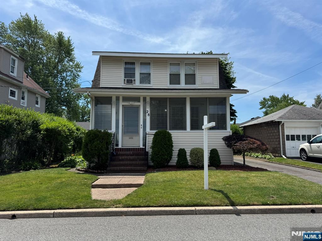 Welcome to 28 Van Houten Street, a charming 3-bedroom, 2-bath home offering comfort, space, and great potential in a convenient Bergenfield location. Step inside to find hardwood floors throughout, a bright and welcoming layout with plenty of natural light, and generously sized living and dining areas perfect for everyday living and entertaining. Enjoy the inviting three-season front porch, a functional enclosed kitchen ready for your personal touch, and three bedrooms with a full bath on the second floor. The full finished basement offers additional living space, a full bath, laundry area, large storage room, and enclosed utilities. Outside, the home features a good-sized backyard, long driveway with parking for 4â€“5 cars, and a detached garage with electricity. A wonderful opportunity to own a well-maintained home with space, functionality, and room to make it your own.