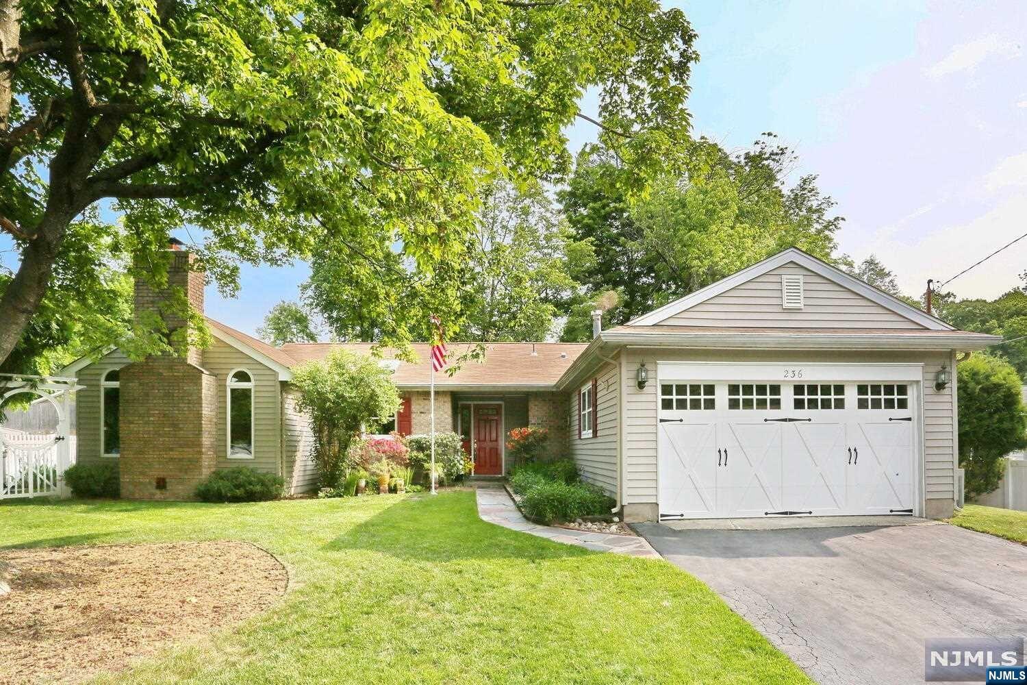 CHARMING EXPANDED RANCH STYLE HOME LOCATED IN SOUGHT AFTER CONTINENTAL WOODS SECTION OF EMERSON. ENTRY FOYER LEADING TO LIVING ROOM WITH WALL TO WALL WINDOWS & BUILT INNS. UPDATED KITCHEN WITH GRANITE COUNTERS OPEN TO DINING ROOM ,GREAT ROOM WITH VAULTED CEILINGS, SKYLIGHTS, BRICK WOOD BURNING FIREPLACE.3 SPACIOUS BEDROOMS & MASTER BEDROOM WITH 1/2 BATH & LAUNDRY. SPECTACULAR BACKYARD WITH COVERED PATIO FLOWERING PERRENIALS & PLUSH LANDSCAPING & WATERFALL. LARGE SHED FENCED YARD NEWER ROOF, NEW HOT WATER HEATER . GARAGE IS A ONE CAR PLUS STORAGE.MORE PICS FRIDAY