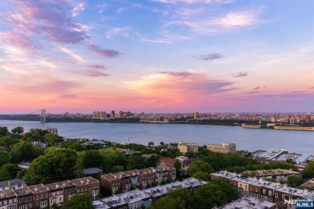 Experience elevated living at Buckingham Tower in Fort Leeâ€™s coveted Gold Coast. This sun-filled 2-bedroom, 2.5-bath (1,742 sq ft) residence features expansive rooms, spacious closets, and sweeping views of the Hudson River and New York City skyline. The bright living and dining areas are surrounded by oversized windows that capture stunning river and city views while filling the home with natural light. This is a rarely available, large, beautifully renovated 17th floor apartment with direct views of NYC. The beautifully designed kitchen offers generous cabinetry, quality finishes, and excellent workspace for everyday living or entertaining. The primary suite includes ample closet space and a private en-suite bath, while the second bedroom also features its own full bath, providing comfort and privacy for guests or family. A convenient in-unit washer and dryer and a powder room complete the residence. Buckingham Tower is a full-service luxury building offering 24-hour concierge and doorman service, valet parking, a resident fitness center, sauna, rooftop swimming pool with skyline views, and a Sky Room entertainment space for gatherings and events. Ideally located with quick and convenient access to NYC, transportation, shopping, dining and Fort Leeâ€™s vibrant downtown. Maintenance includes basic cable/internet, and indoor parking. Maintenance $1,317 + Capital reserve $376 + Cable/Internet $21 + Parking $115 /car.