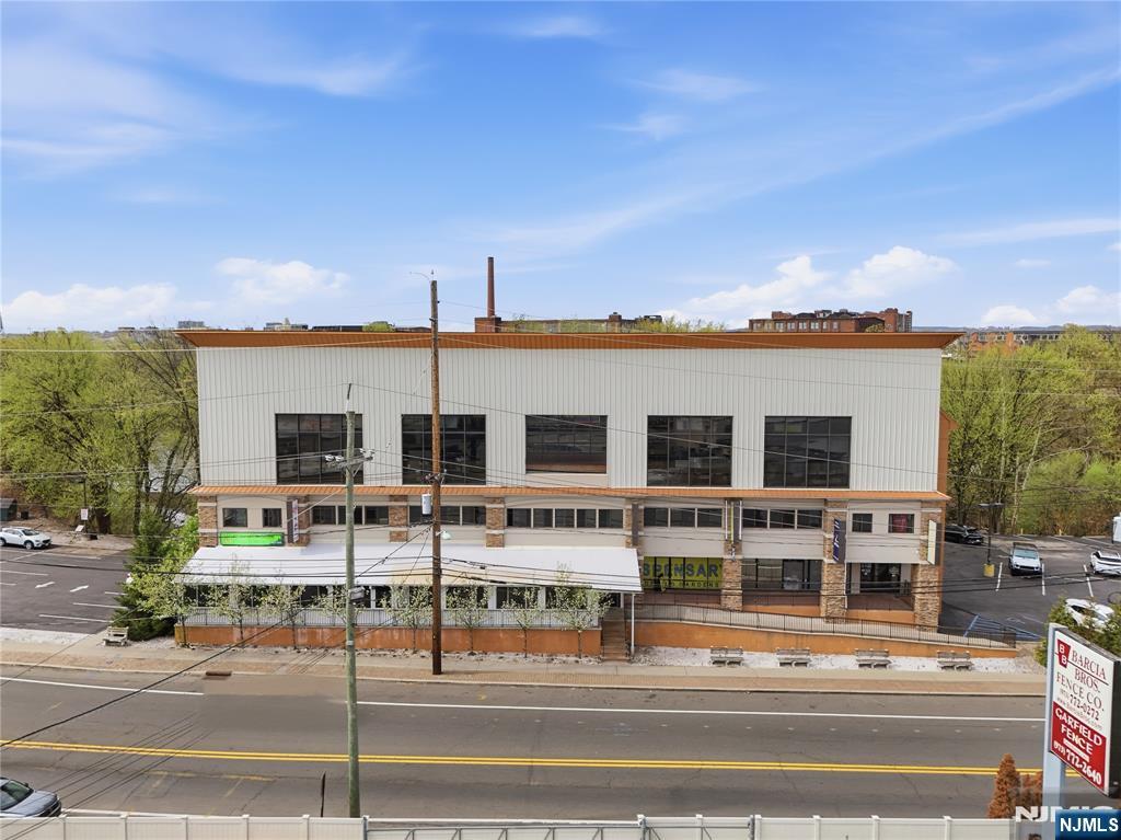 Exceptional, high-visibility commercial investment on River Drive featuring two standalone, well-maintained buildings with long-tenured, qualified tenants and a diverse, service-driven tenant mix. Building One offers approximately 29,000 SF and is occupied by 14 established tenants, including personal care, retail, fitness/sports recreation, and restaurant uses. Notably, the property features an impressive Indoor soccer facility on the third floor and a popular upscale bar/restaurant. The site is supported by approximately 75 parking spaces, providing a rare convenience for a multi-tenant asset of this size. Building Two is fully occupied by a well-known local grocery store, serving as a daily-needs anchor for the surrounding community. The property sits directly across from The Venetian and benefits from strong daily traffic counts along River Drive. Surrounded by national retailers such as The Home Depot, the location offers excellent consumer draw and long-term stability. Immediate access to New Jersey Route 21, New Jersey Route 17, and U.S. Route 46 further enhances regional connectivity. A rare opportunity to acquire a turnkey, income-producing commercial asset in a prime Bergen County corridor with strong in-place cash flow and future upside. Positioned for both immediate income and long-term appreciation, this asset offers investors a compelling blend of location, tenancy, visibility, parking, and durable commercial demand.