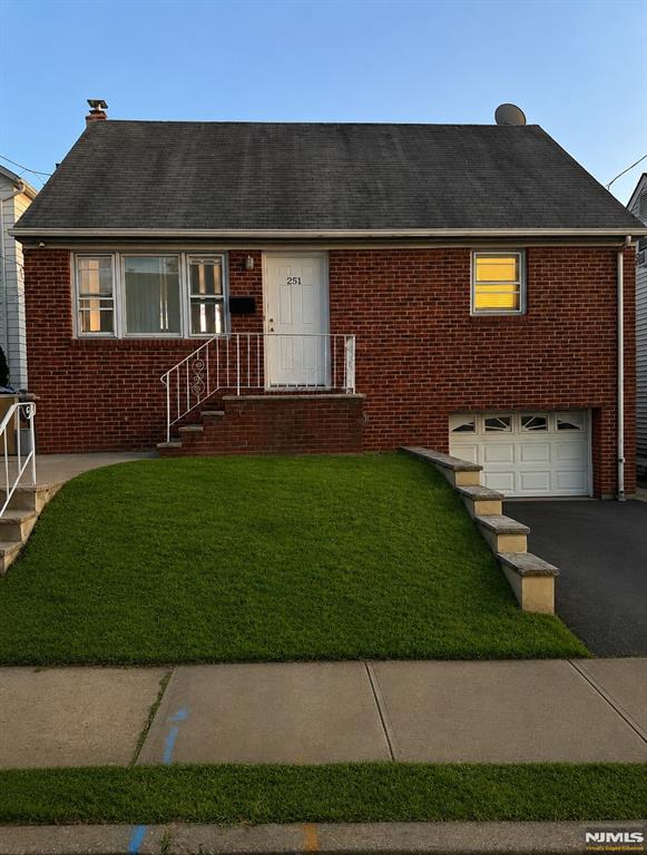 Charming and updated brick-front Cape Cod situated on a quiet residential street. This well-maintained four-bedroom home features beautiful hardwood floors throughout the main level and brand-new luxury vinyl plank flooring in both second-floor bedrooms. The home offers a one-car garage, along with a private driveway for additional parking. Enjoy the comfort of a gas forced hot air heating system and central air conditioning. New hot water heater from 2024. The eat-in kitchen features modern cabinetry and provides direct access to a spacious backyard, complete with a deck that's perfect for outdoor dining, entertaining, and summer barbecues.