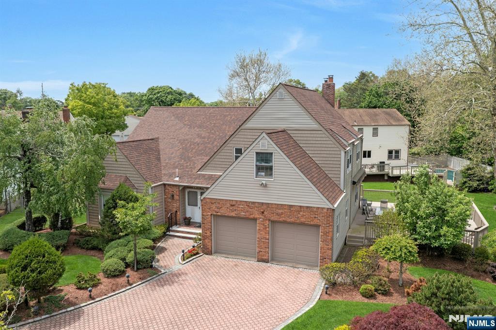 This beautiful Col with top Location, great Neighborhood & on a Cul-de-Sac has been freshly painted & showcases the expanded 5BR/3.5 bath with updates & attention to detail. Enter an airy DBL E-Foyer w/soaring ceilings & adorned w/antique chandelier. Notice gleaming wood floors throughout. Entertain in the oversized sunlit LR w/bow windows that open to the adjoining DR for large gatherings. Treat yourself to a well-appointed chefs kit w/granite counters, premium SS appliances, 6 burner stove w/oven, wall-oven w/warming draw &microwave, abundant cabinetry, pantry as well as under cabinet lighting. Breakfast rm w/door out to an expansive 2 tier deck w/retractable awning. Adjoining spacious Fam/Rm w/FPL. Laundry &PR complete the first level. Upstairs the Primary BR retreat has 2 WIC & en-suite Fbath. Four addtâ€™l BRâ€™s, one can be used as your office & Hallway bath w/SOT. Fin bsmt has F/Bath, Rec Rm, w/Bar &ample storage. Offers paver drive& walkway, 4 Z Heat&AC, security system, 5 Zone sprinklers, crown-molding, recess lighting &built-in speakers. Enjoy a serene private picturesque yard & notice a gentle brook in the rear. Present Owners had the privilege of Radburnâ€™s top-rated blue-ribbon school district and took advantage of being near houses of worship & NY Transportation. Sold as is with no known defects. Two photos virtually staged.