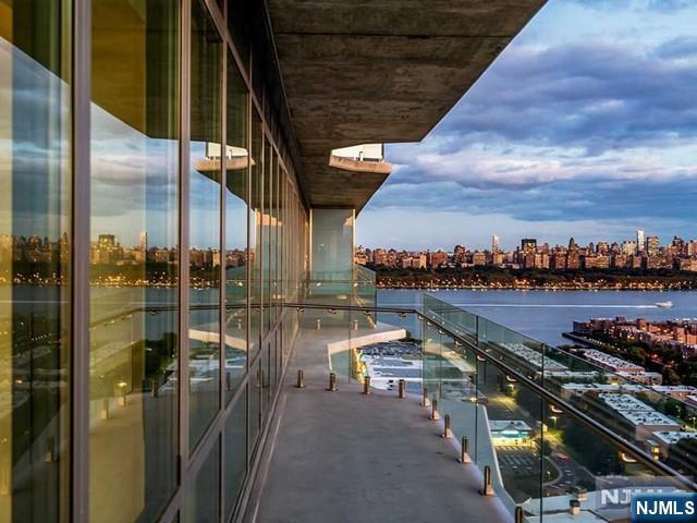 Priced for a quick sale at the ultimate in views and luxury at "One Park" in Cliffside Park. Unit 319 is their signature, 3 bedroom east facing line that has an open floor plan with direct views of the Hudson River & NYC, from all rooms. It has floor to ceiling double-glazed windows, high performance Daikin HVAC system, w/zoned controls. A brand-new kitchen with an extended Cielo Quartzite countertop & Cielo backsplash & Thermador appliances. The spa-like bathrooms have a dramatic wall of polished Blue de Savoie porcelain slabs with walk-in showers and double vanities, custom walnut vanity w/Kohler fixtures. The home comes w/enhanced wiring infrastructure for Smart home technology and has ample storage throughout. There's also a golf simulator, media room & billiard room, creative children's playroom, yoga room and guest suites. This is a stunning contemporary high rise with an impressive 25,000 sq. ft of amenities. These include the exquisitely designed indoor pool w/an adjacent sun deck with incredible views. It has a lobby like no others with the artwork, circular staircase and ultra-modern atmosphere. There is a fitness center, sauna, plus another outdoor area, with a fire pit, grilling stations, and even an outdoor theater. It also has a dog run w/separate pet door access and even a wash area for them. Everything has been carefully thought of in this 5-star vacation-like setting.