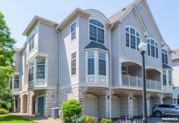 Welcome to this beautifully maintained 2-bedroom, 2.5-bath Bristol unit in the sought-after Regency Club in Livingston. This spacious townhome features a stunning eat-in kitchen with upgraded appliances, Dutch Made custom cabinetry, and ample counter space, perfect for both everyday living and entertaining. The inviting living room opens to a private balcony overlooking lush greenery, creating a peaceful retreat. A formal dining room and built-in cabinetry throughout add elegance and functionality. The sunlit loft offers the ideal space for a home office or reading nook. The primary suite boasts an en-suite bath and walk-in closet. Enjoy the convenience of an attached garage and in-unit elevator (currently non-operational). The Regency Club offers resort-style amenities including 24-hour security, tennis courts, an outdoor pool, and a clubhouse including a fitness center. Prime location near shopping, dining, and NYC transportation.