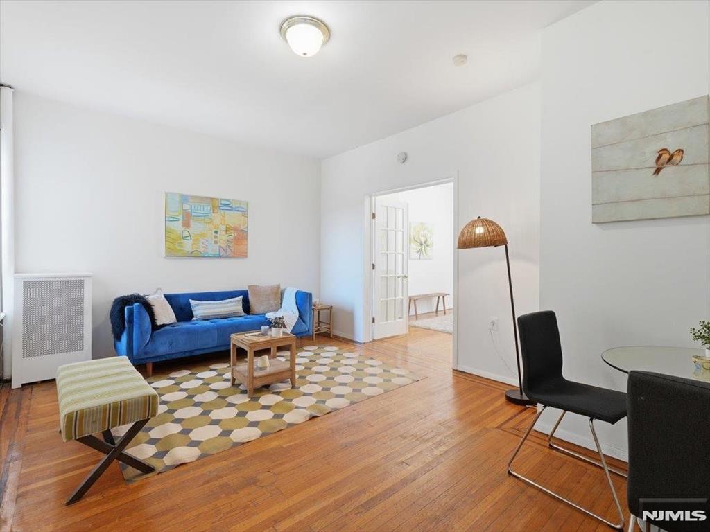 Don't miss the opportunity to call this recently renovated, spacious 1 bed, 1 bath condominium in the heart of Journal Square your home! Whether you're a first-time buyer or investor, this is an exceptional opportunity in one of Jersey Cityâ€™s most dynamic neighborhoods. Located just one flight up,in a prewar building, this corner unit is bathed in natural light and features a spacious open layout with beautiful hardwood floors throughout, offering a perfect mix of historic charm and modern upgrades. Enjoy the convenience of in-building laundry, close proximity to an array of shops and dining, and excellent access to public transportation, including the Journal Square PATH station and a direct NYC bus to Port Authority.