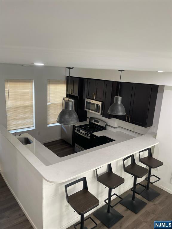 Welcome to this stunning rental brownstone located in the heart of the Historic St. James Commons section of Newark. This home features five bedrooms and two bathrooms, along with beautiful hardwood floors throughout. The full kitchen is equipped with granite countertops, making it ideal for any culinary enthusiast. Additionally, there is a laundry room conveniently located on the lower level. Enjoy the spacious patio, perfect for outdoor relaxation, and take advantage of the property's proximity to major highways and transportation options. Outfitted with luxury finishes and custom interior designs, this fully renovated brownstone, completed in 2021, has been designed with travelers' needs in mind. This property is perfect for anyone seeking a high-end rental. Don't miss the chance to make it your own!