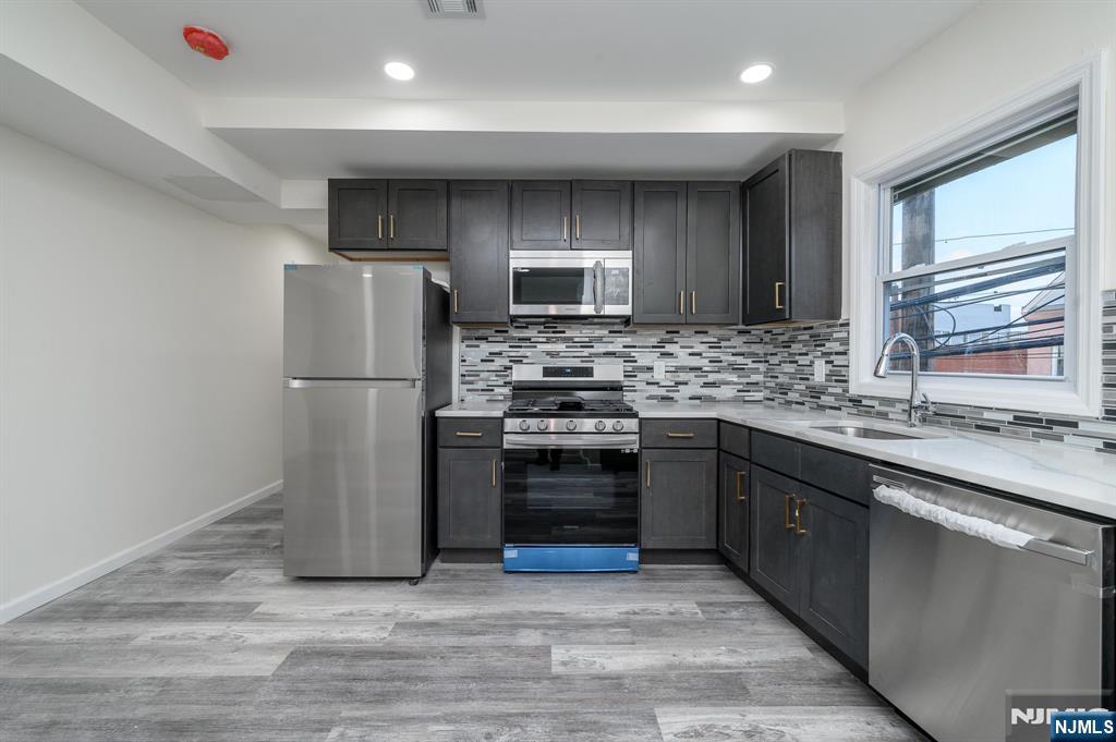 Experience beautifully remodeled Newark home! This stunning 3-bedroom, 2-bathroom unit has been fully renovated from top to bottom, offering modern comfort and ultimate convenience. This brand new kitchen is equipped with premium stainless steel appliances, modern upgrades, freshly finished, clean floors and an entirely new HVAC system for year-round comfort. Spacious living space with three generously sized bedrooms, including a private master suite with ample closet space. Nestled in a vibrant neighborhood, you are just minutes away from everything you need. This completely transformed apartment is absolutely an opportunity that you can't miss! Schedule your tour today!