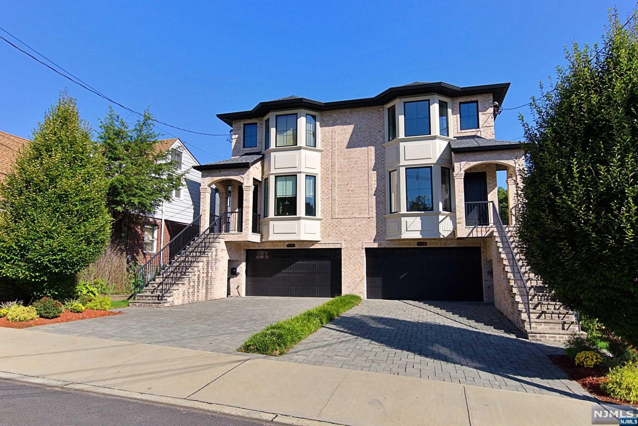 Fantastic, Side by side, 2 family home built in 2017 with a unique, huge, back yard! Located in the heart of Fort Lee this home is close to schools, shops, houses of worship and NY transportation. Both sides include: Ground floor; family room/4th bedroom, powder room, walk in closet, utility room, true 2 car garage, sliding doors to large patio and yard. First floor has living room with fireplace, dining room, powder room, eat in kitchen with stainless steel appliances and Quartz counters, sliding doors to large deck. Second floor has 2 large bedrooms, family full bath, laundry room, primary bedroom with vaulted ceilings, primary bathroom. Some highlights include; large yard, 3 zone heating and 2 zone ac, 2 car garage, underground sprinklers, electric car charging port, all closets are finished with built in cabinetry and so much more. Don't miss out on this great opportunity!