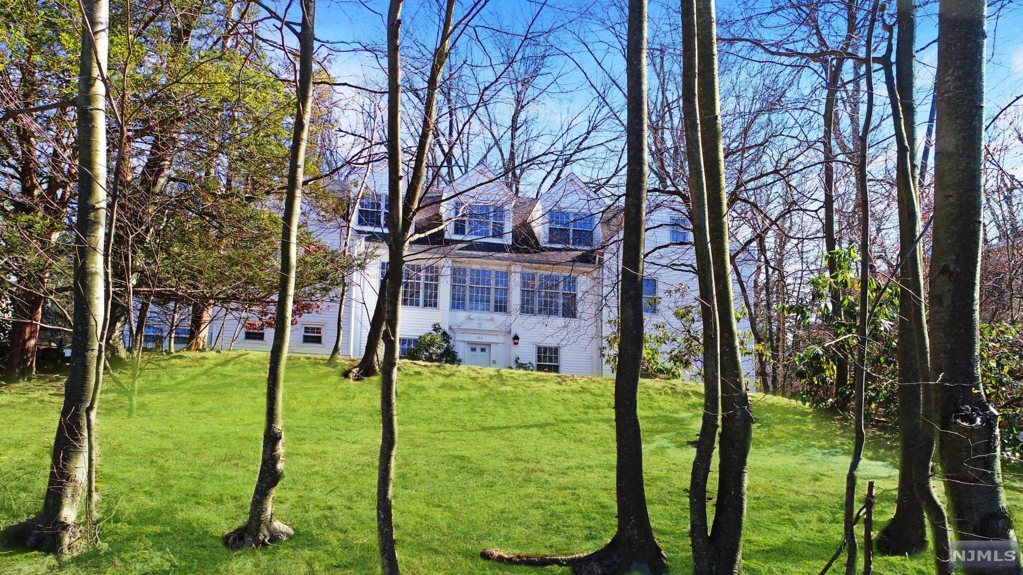Set high on a knoll, this 6 Bedroom Colonial has fabulous seasonal western views & its JUST 1 mile from the George Washington Bridge! As you enter this residence's spacious entry Hall, you are greeted with an office, Playroom and a fabulous Rec Room w/Fpl & Wet Bar. The second level space is captivating with a huge Sun filled Florida room that graces the home with French Doors that access the Living room, entertainment sized formal Dining room, wonderful Eat-in-Kitchen w/center Island, PR and exit to patio. This level also has a separate Guest Suite with Sitting rm/Fpl (now used as den) & 2 Bedrooms, a Full Bath w/Sauna & Steam shower. 3rd fl. has MBR/Mbth, 3 BRS, Full Bath, a Laundry room & Storage closet which completes this level. Now in our new normal, there are many private places to host home offices. This retreat gives you the ultimate privacy when trees are in full bloom! 5 min to all Major Hi-Ways, walk to NYC Transportation. All offers in writing to LB w/Pre-App
