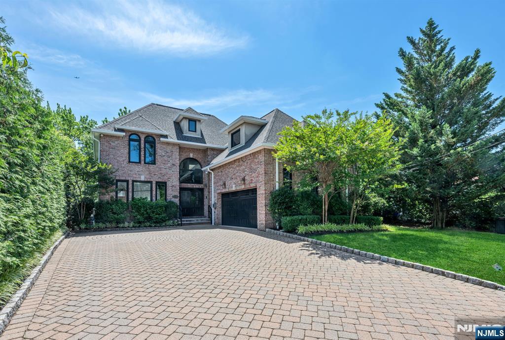 THIS "PERTURE PERFECT HOME" BUILT IN 2002 HAS BEEN TOTALLY RENOVATED TO AN EXTREMELY HIGH STANDARD: NEW ROOF, NEW WINDOWS, NEW STONE PATIO W/OUTDOOR KITCHEN, NEW LNDSCPG. NEWER FENCING,STONE FIRE PIT,STONE PAVER DRIVEWAY, NEW NEST SYSTEM W/VIDEO CAMERAS,NEW GARAGE DOOR & OPENER.NEW FOYER FLOOR,NEW BATHS,NEW A/C UNIT,NEW RECESSED LIGHTING,GAS FURNACE 5 YEARS, 2 HOT WATER HEATERS/2 YEARS.THIS BRICK COLONIAL SHOWCASES AN OPEN FLOOR PLAN, 9' CEILINGS, HARDWOOD FLOORS T/O. THE MAIN LEVEL OFFERS FORMAL LIVING ROOM, FORMAL DINING ROOM, FAMILY ROOM/FPL, OFFICE, UPDATED KITCHEN EXITING TO THE PRIVATE REAR YARD. THE SECOND LEVEL IS COMPLETE W/PRIMARY SUITE WITH SITTING AREA, AMPLE WALK-IN CLOSETS & AN UPDATED BATH, BEDROOM W/NEW BATH & 2 BEDROOMS W/NEW DUAL BATH. THE LOWER LEVEL OFFERS A RECREATION ROOM, GYM, BEDROOM & FULL BATH. THE HOME IS CONVENIENTLY LOCATED TO SCHOOLS, SHOPPING & HOUSES OF WORSHIP JUST 1 MILE FROM NEW YORK CITY & CONVENIENT TO ALL MAJOR AIRPORTS.THIS HOME IS A RARE FIN