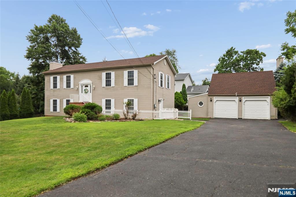 Welcome to this beautifully maintained, sun-filled bi-level home in the heart of highly sought-after Old Tappan! This spacious residence offers 4 bedrooms, 3 full bathrooms, and a versatile layout designed for today's lifestyle. The Main level features a bright and inviting living room, an elegant dining area, and a modern eat-in kitchen with stainless steel appliances. Three bedrooms and two full bathrooms complete the upper level. Step outside onto the newer composite deck, a great setting for outdoor dining, entertaining or simply relaxing. The lower level expands your living space with a large family room featuring a cozy gas fireplace, a fourth bedroom a full bathroom, and an additional bonus flex space that can easily serve as a home office, fitness room, or playroom. Additional highlights include a detached two-car garage with a work space, a roof that is three years old, and a functional floor plan that offers flexibility for multi-generational living, hosting guests, or working from home. Ideally located in one of Bergen County's most desirable communities, you'll enjoy top-rated schools, beautiful parks, quiet tree-lined streets, and convenient access to shopping, dining and walking distance to the high school. Don't miss this exceptional opportunity to own a spacious home in prestigious Old Tappan. Home is being sold as is.