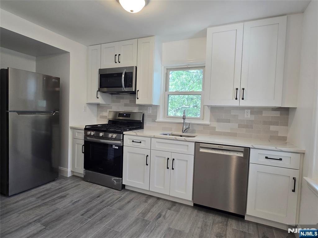Newly Renovated and very spacious 3-bedroom apartment in the heart of Pequannock. Enjoy the perfect blend of style and space in this renovated apartment. The brand new kitchen features quartz counters, stainless appliances, and a pantry, while the large formal dining room is ideal for entertaining. Gorgeous wood floors throughout most of the home. New bathroom.with large linen closet. Bright open living room with lots of natural light. Central Air, Stackable washer/dryer in unit, basement storage, and a flexible floor plan make this home as functional as it is inviting. Prime commuter location close to NYC buses and trains and major highways. Near restaurants, shopping, bars.