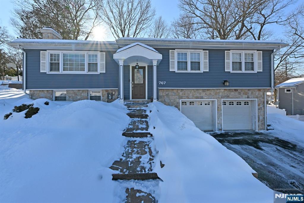 Updated 3-bedroom, 2-bath bi-level home filled with warmth, space, and everyday comfort. Hardwood floors flow through the main level, featuring a bright living room with fireplace and a nice-sized dining room perfect for gatherings. The kitchen opens to a large deck overlooking a fully fenced yard â€” ideal for relaxing or entertaining. The primary bedroom offers its own private bath for added privacy. Downstairs youâ€™ll find a spacious recreation room with a second fireplace, an additional room perfect for an office or storage, a laundry area, and direct access to the 2-car garage. Conveniently located near transportation, schools, and shopping. Landlord will consider one pet under 30 lbs. A welcoming place that truly feels like home.