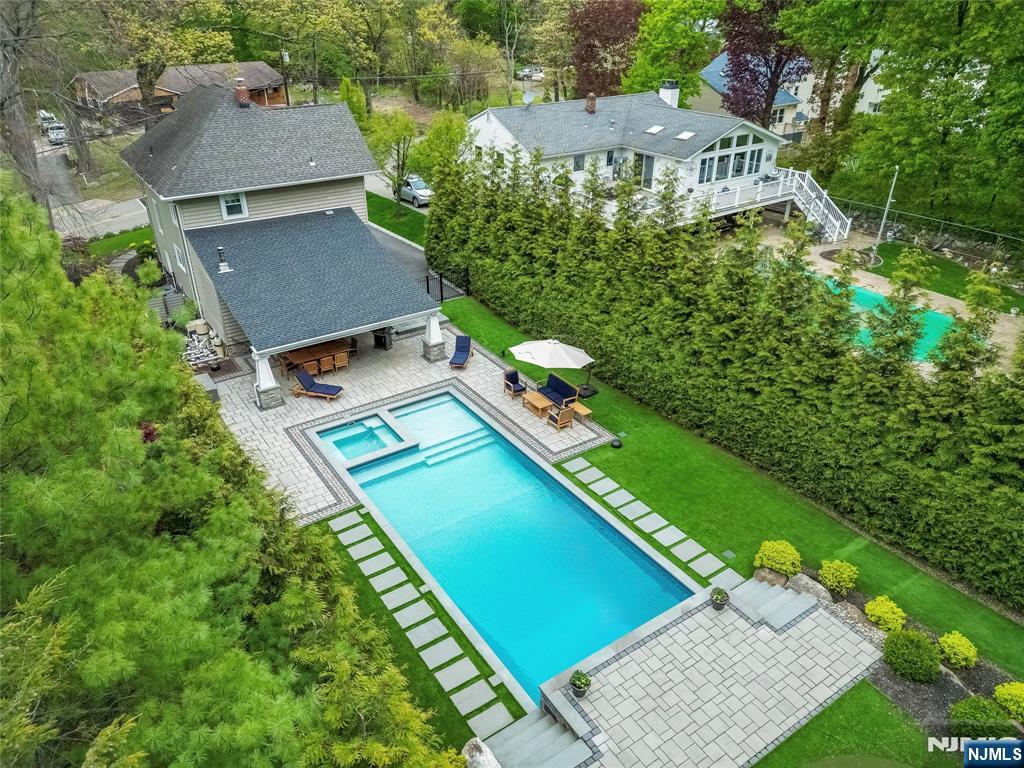 Welcome to this charming Cragmere homeâ€”complete with the perfect mix of charm and modern luxuries. This renovated home offers three beautifully finished levels of living space and a backyard oasis featuring an in-ground pool set on a resort-like setting. Inside, youâ€™ll find an expanded primary suite with a private sitting area and walk-in closet. Thoughtful upgrades include updated bathrooms, an expanded family room, extensive trim work, and seamless indoor-outdoor living. Step outside to enjoy a cedar front porch and a covered rear patioâ€”perfect for entertaining or relaxing year-round. Ideally located close to downtown, shopping, schools, and train access, this home truly embodies pride of ownership in every detail.