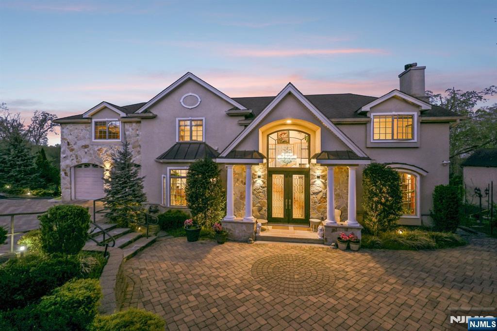 Incredible 3,700 sq ft Colonial tucked away on a quiet cul-de-sac, backing directly to Wood Dale Park for unmatched privacy, serenity, and natural beauty in every season. The sellers fell in love with the peaceful setting, where mornings are quiet, evenings feel private, and the backdrop of nature never gets old. This 5-bedroom home is thoughtfully designed for both everyday living and entertaining. Every bedroom offers direct access to a bathroom, creating comfort and convenience for family and guests alike. The heart of the home is the inviting kitchen with radiant heated floors, perfect for gatherings large or small, flowing seamlessly into spacious living areas filled with warmth and light. The primary suite is a true retreat, featuring radiant heated floors in the spa-like bath and an oversized walk-in closet you have to see to believe. Step outside to your own resort-style oasis: a two-tier deck overlooking a heated gunite pool, tennis court, basketball hoop, and a fully heated and air-conditioned pool cabana complete with kitchen, full bath, and laundry. This is more than a home, itâ€™s a private lifestyle destination.