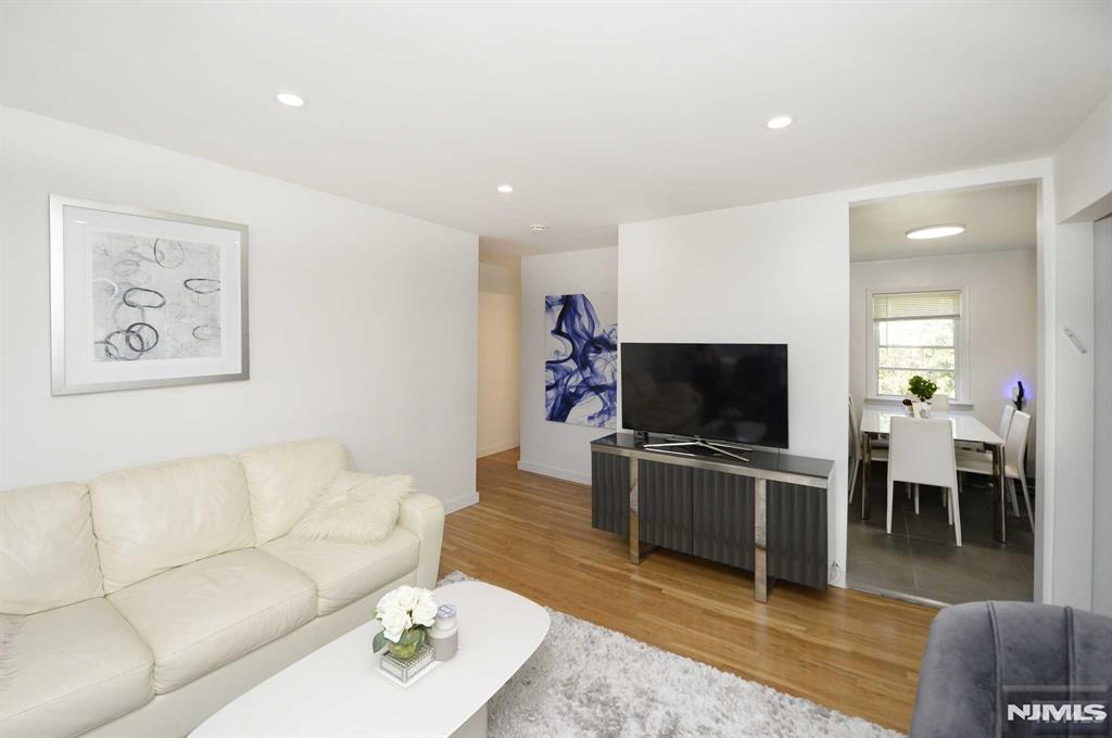 Welcome to this inviting 2-bedroom, 1-bathroom Secondary floor condo for rent in sought-after Fair Lawn! Perfectly located just steps from the train station, this prime spot offers an effortless commute to NYC, award-winning schools, a variety of restaurants, and easy access to major highways. Thoughtfully updated, this condo features a designer kitchen with a convenient in-unit washer. Both bedrooms are generously sized, and the living room is bathed in natural light, creating a warm and welcoming atmosphere. Parking is included with the condo. For added convenience, there's also a shared laundry facility in the basement. Combining a fantastic location with updated interiors, this condo is the perfect place to call home.Don't miss your chance to enjoy comfortable, stylish living with everything you need right at your doorstep!