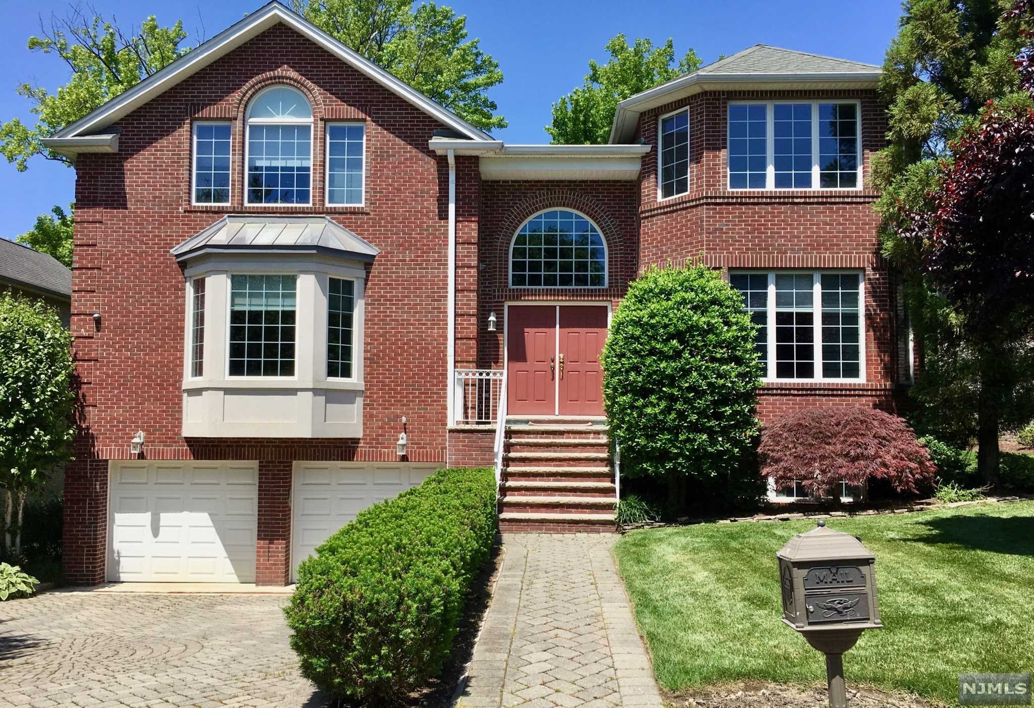 Timeless Beauty in CUL DE SAC Location! Classic Brick Colonial. Outstanding spatial design defines this impressive 5 bedroom, 4.5 bath home. Welcoming double height entrance has radiant heated marble floors. Home is designed for entertaining with oversized dining and living rooms. Chef's kitchen is equipped with high end stainless appliances/ granite counters with access to deck/patio. Enjoy cozy fires in the family room just off the kitchen. Large den has option of creating 1st floor bedroom for extended family. Upstairs: Spacious MasterBedSuite/Full Bath, Jacuzzi, Shower and dbl vanities, large JuniorSuite/Fbath and 2 additional bedrooms share Jack/Jill Bath. Fabulous Basement offers a Recreation Room, TV Room/with wet bar, Bedroom/Fbath, 2 Car Garage. Convenient to school, daycare, close to transportation.