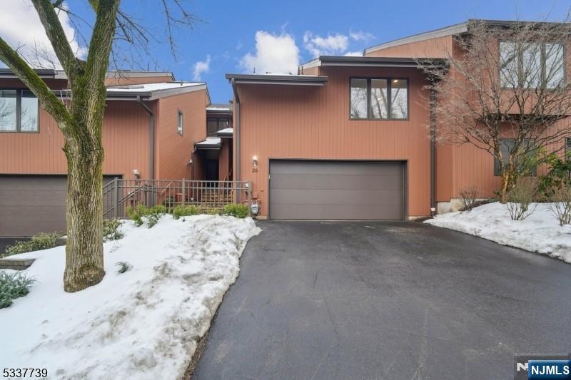 Evergreen model townhome completely gutted & modernized with top-of-the-line finishes.STUNNING redesigned kitchen boasting custom cabinetry, stainless steel appliances, a center island with quartz countertops plus a large wall-to-wall pantry.The open concept allows for a seamless flow into the great room; which can accommodate a dining area surrounded by newer windows,skylights,a gas fireplace & sliders to the deck and backyard. CONTEMPORARY natural oak hardwood floors adorn the entire first floor including the foyer,staircase & rough iron railing spindles. Every room has new light fixtures, doors & flooring while the crisp yet neutral palette is a perfect backdrop for your furnishings. The primary bedroom has three closets while the primary bathroom has an oversized spa shower with Carrara marble,two sinks with quartz countertops, and custom cabinets. The second bedroom en-suite has an updated bathroom with quartzite countertops, closets & privacy. The lower level basement has a recreation area, office/bedroom, laundry room, storage & updated full bathroom.Other highlights include a new garage door,new furnace,and 75-gallon H2O heater. Amenities include a HEATED outdoor pool, tennis/pickleball courts, clubhouse & exercise room. Conveniently located near Verona Park,Montclairs' art & dining,easy access to major highways, and Houses of Worship. The Woodlands entrance is steps from a Jitney/shuttle bus (Free) to NJ Transit trains with a no-hassle commute into NY Penn station! A