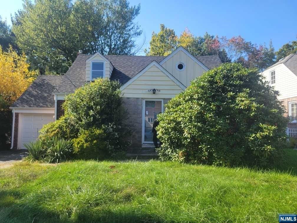 Cape Cod style home offering 2 bedrooms & 1 bathroom w/ walk up attic space minutes from Cherry Hill School, major highways, stores and all major transportation! This home offers one floor living, with hardwood floors throughout, complete with one car attached garage. With some Reno & TLC this home will be in move in ready. Perfect for investor or personal use. Incredible opportunity to start a family and live in the beautiful town of River Edge!
