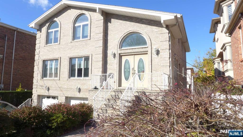 This large,contemporary two-family features 7 beds and 5 baths,offering ample space and comfort. The all-brick exterior and south/east facing exposure a bright and sunny stmosphere. Located ina quiet and convenient area just a few blocks from Broad Ave.,this property boasts hardwood floors through out,a modern large kitchen,and washer/dryer units in first and seconf floors.Enjoy the comfort of central A/C and baseboard heating.Separate utilities for gas,electricity and water.The finished large basement,with separate entrance and full bathroom,adds versatility.Additional features include a brick-paved driveway,entrance ways,fenced backyard and well-maintained lot 50 X 100.This home is perfect for those seeking a blend of modern amenties and a prime location.A few blocks away for NYC bus stop.