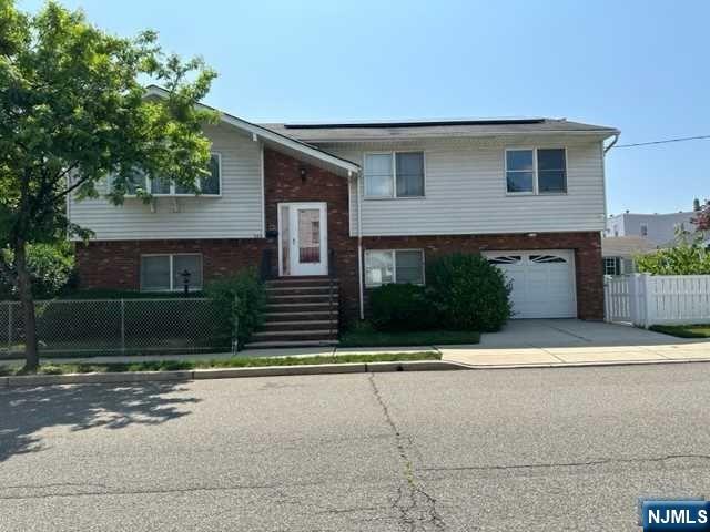 2 FAMILY BI-LEVEL WITH MAIN LEVEL THAT OFFERS 3 BEDROOMS 2 FULL BATHS W/ MAIN B/R BTH - OPEN CONCEPT W/LIVING ROOM -DINING ROOM -HARD WOOD FLOORS THRU OUT - NEW KITCHEN W/ GRANITE COUNTER TOPS - ALL NEW APPLIANCES - CENTRAL AIR -1ST LEVEL LA -1ST LEVEL LAUNDRY RM - FAMILY ROOM WITH FULL BATH -ALSO 1 BEDROOM RENTAL APT W/ SEP ENTRANCE -SEP UTILITIES - YARD -GARAGE- EACH UNIT HAS IT'S OWN ELECTRIC SOLAR SYSTEMS. THIS HOME IS CONVENIENTLY LOCATED NEAR NYC TRANSPORTATION , SCHOOLS, PARKS, SHOPPING AND MORE.