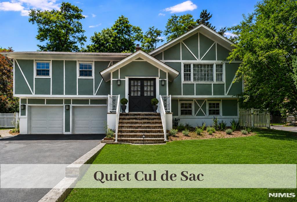 Nestled in Quiet Cul-de-Sac, this Sunlit and Spacious Residence offers an exceptional blend of Tranquility, Convenience, and Pride of Ownership, just moments from Town, Train, Shops, and Restaurants. Entrance Foyer provides full views of both Upper & Lower Level for Seamless Lifestyle & Entertaining Flow. Formal Living Rm with Picture Window & important Crown Molding transitions to Dining Room w Glistening Hardwood Flooring ready for Holiday Gatherings and Celebrations. Immaculate Eat-In Kitchen with Stainless Appliances and generous Counters & Cabinetry offers amazing access to Convenient Deck overlooking Park-Like Backyard. Down the hall you will find the 1st of 2 Primary Bedrooms w EnSuite Bath, 2 more Bedrooms and Hall Bath w Double Sinks. Lower Lever boasts a Roomy & Inviting Family Room w Fireplace. Nearby is a 2nd Primary or Guest Bdrm, Full Updated Bath and Office Nook. Rear yard with Flat Grassy Lawn delivers Mature Plantings, Storage Shed, Fencing, Paver Patio and Deck Many Ceiling Fans. Recessed Lights throughout. 2 Car Attached Garage, Coveted HHK Elementary K-8 Grade & nationally ranked Northern Highland HS w Bussing. A Rare Opportunity to establish roots in this highly sought-after community.
